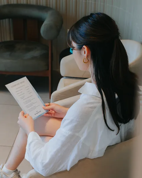A patient reading the comfort menu in the Springs waiting room.